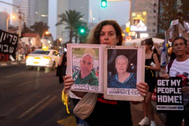 Tel Aviv, Israel - OCT 28, 2023 - Israeli civilians gathered in solidarity for ceasefire between Israel and Gaza, holding banners for the missing and kidnapped Israeli people, Kaplan Street, Tel Aviv. clipart