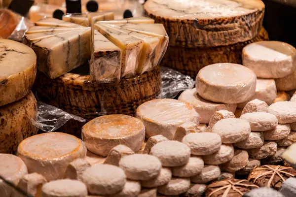 stock image Traditional French cheese sold at Les Halles de Lyon Paul Bocuse, built in 1971 in the 3rd arrondissement of Lyon, Auvergne-Rhone-Alpes, France.