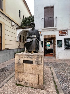 Cordoba, Spain - FEB 25, 2022: Statue of the Jewish scholar Moses Maimonides, Rabbi Mosheh Ben Maimon, Cordoba, Andalusia, Spain. clipart