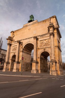 The Siegestor, The Victory Gate in Munich is a three arched memorial arch, crowned with a statue of Bavaria with a lion quadriga. clipart