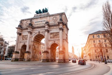 Munich, Germany - December 23, 2021: The Siegestor, The Victory Gate in Munich is a three arched memorial arch, crowned with a statue of Bavaria with a lion quadriga. clipart