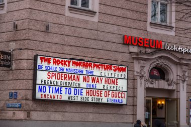 Munich, Germany - DEC 26, 2021: The Museum Lichtspiele is a movie theater in Munich, situated in the district Au next to the Deutsches Museum and along the Isar bank. clipart