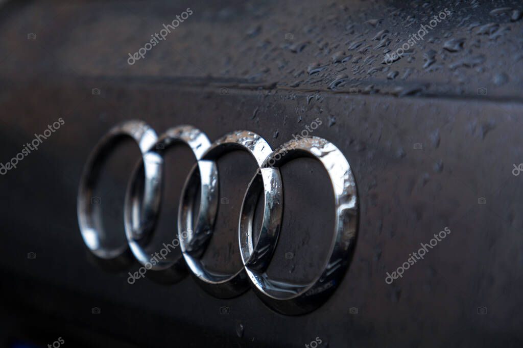 Munich, Germany - DEC 25, 2021: Close up shot of Audi logo on a car. Audi AG is a German automotive manufacturer of luxury vehicles.
