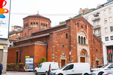 Milan, Italy - 30 March 2022: San Babila is a Romanesque style Roman Catholic church in Milan, region of Lombardy, Italy. clipart