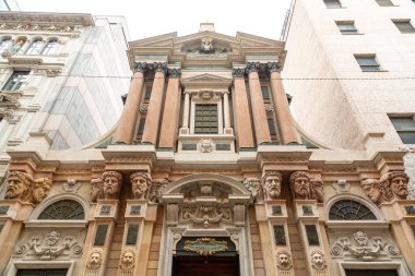 Milan, Italy - 30 March 2022: Front facade of San Raffaele Church in Milan, Italy. clipart