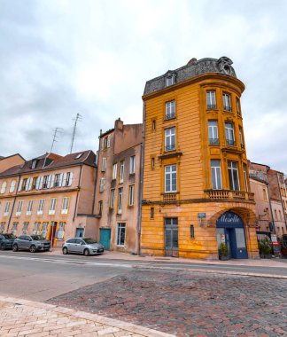 Metz, France - January 23, 2022: Street view and typical french buildings in the city of Metz, France. clipart