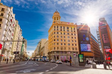Madrid, Spain - FEB 16, 2022: The Gran Via is one of Madrid's most important shopping areas, with a large number of hotels and movie theatres. clipart