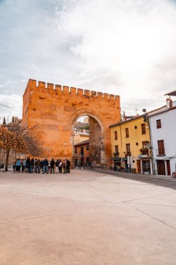 Granada, Spain - February 23, 2022: Puerta de Elvira is an arch gate in Granada, Spain. It was declared Bien de Interes Cultural in 1896. clipart
