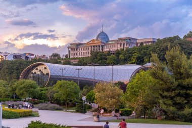 Tbilisi, Georgia - 16 JUNE, 2024: The Musical Theatre and the Exhibition Hall located inside the Rhike Park in Tbilisi, the capital of Georgia. clipart