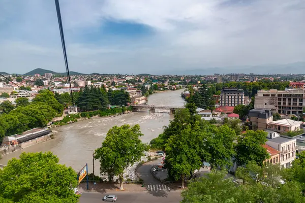 stock image Kutaisi, Georgia - June 15, 2024: The Rioni is the main river of western Georgia, originating in the Caucasus Mountains, in the region of Racha and flows west to the Black Sea.