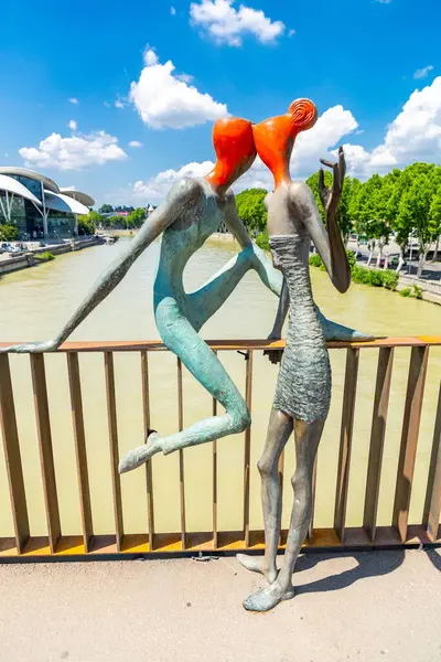 stock image Tbilisi, Georgia - 17 JUNE, 2024: Modern and stylized human sculptures on the Baratashvili Bridge over the Kura River in Tbilisi, capital of Georgia.