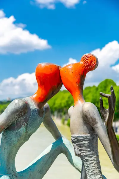 stock image Tbilisi, Georgia - 17 JUNE, 2024: Modern and stylized human sculptures on the Baratashvili Bridge over the Kura River in Tbilisi, capital of Georgia.