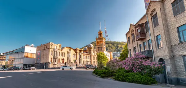 stock image Tbilisi, Georgia - 23 JUNE, 2024: Buildings around the Rustaveli metro station where the Rustaveli Avenue starts from the First Republic Square, Tbilisi, Georgia.