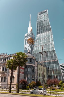 Batumi, Georgia - 13 JUNE 2024: Exterior view of the modern tower of Radisson Blu Hotel on Ninoshvili Street in the city of Batumi, Adjara, Georgia. clipart