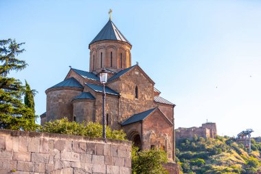 The Metekhi church of the Nativity of the Mother of God, known simply as Metekhi, is a Georgian Orthodox Christian church located on the left bank of the river Kura. clipart