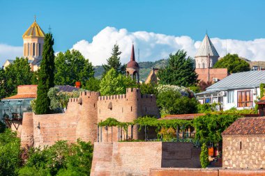 Tbilisi, Georgia - 22 JUNE, 2024: The remains of the old Isani fortress bastions and walls in Metekhi historic neighborhood in Tbilisi, Georgia clipart