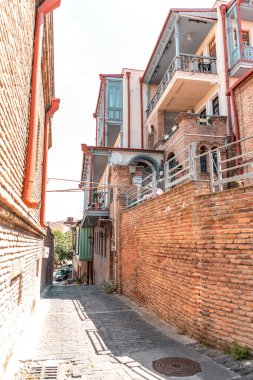 Tbilisi, Georgia - 12 AUG, 2024: Street view and traditional architecture in the old town of Tbilisi, Georgia. clipart