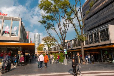 Rotterdam, Netherlands - October 10, 2021: The Lijnbaan is the main shopping street of Rotterdam. It was opened in 1953. clipart