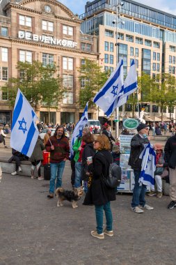 Amsterdam, the Netherlands - October 10, 2021: Israeli people protesting at the Dam Square of Amsterdam, the capital of the Netherlands. Located 750 meters south of the central station. clipart