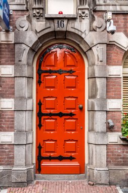 Amsterdam, NL, 10 OCT 2021: Architectural detail from typical Dutch buildings in Amsterdam, the capital of the Netherlands. clipart