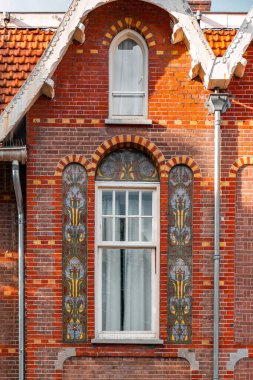 Architectural detail from typical Dutch buildings in Amsterdam, the capital of the Netherlands. clipart