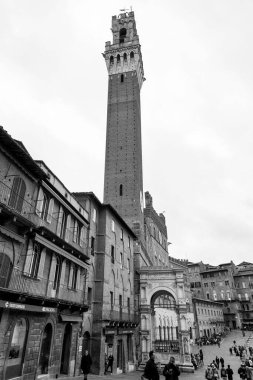 Siena, Italy - APR 7, 2022: The Palazzo Pubblico, town hall is a palace located at the Piazza del Campo, the central square of Siena, Tuscany, Italy. clipart