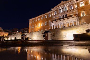 Athens, Greece - 26 Nov 2021: Syntagma Square is the central square of Athens, located in front of the 19th-century Old Royal Palace, housing the Greek Parliament since 1934. clipart