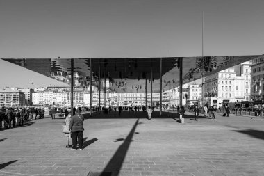 Marseille, France - January 28, 2022: The Mirror at the old port of Marseille. Giant mirrored canopy called the Port Vieux Pavilion was designed by Norman Foster. clipart