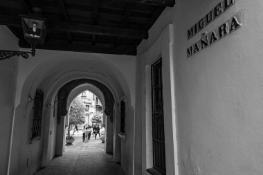 Seville, Spain-FEB 24, 2022: Typical street view and generic architecture in Seville, Andalusia, Spain. clipart