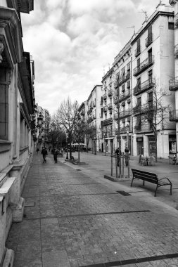 Girona, Catalonia, Spain - FEB 12, 2022: La Rambla de la Llibertat is an avenue in the Old Barri of Girona. The Freedom Tree was planted there in 1869 during the Democratic Sixth Century 1868 - 1874. clipart