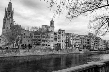 Girona, Catalonia, Spain - FEB 12, 2022: Exterior view of the Church of San Felix or Sant Feliu at Placa de Catedral, Girona, Spain. clipart