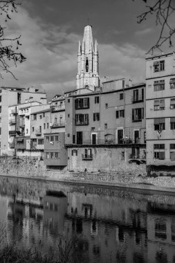 Girona, Catalonia, Spain - FEB 12, 2022: Exterior view of the Church of San Felix or Sant Feliu at Placa de Catedral, Girona, Spain. clipart