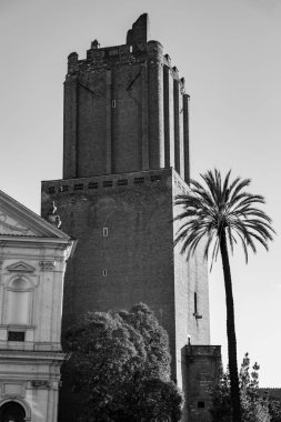 La Torre delle Milizie, an ancient leaning tower next to the Trajan Market in Rome, Italy clipart