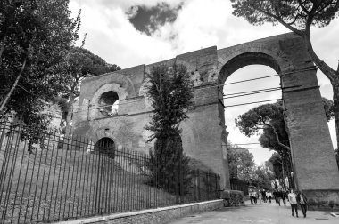 Rome, Italy - April 7, 2019: Aqua Claudia was an ancient Roman aqueduct that was begun by Emperor Caligula in 38 AD and finished by Emperor Claudius. clipart