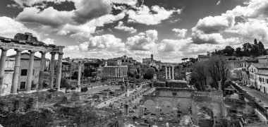 Rome, Italy - April 5, 2019: Forum Romanum is a rectangular forum surrounded by the ruins of several important ancient government buildings at the centre of Rome. clipart