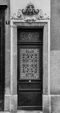 Old and beautiful ornate door, classic architectural detail found in metz, France clipart