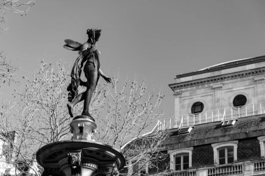 Paris, France - January 24, 2022: River Nymph scultpure on top of a fountain at Andre Malraux Square in Paris, France. clipart