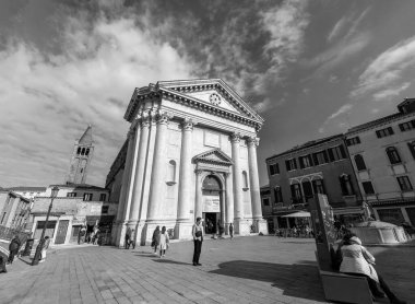 Venice, Italy - April 3, 2022: Campo San Barnaba is a square in the Dorsoduro sestiere of Venice, Italy. The neighborhood's church is the San Barnaba. clipart