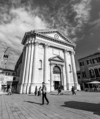 Venice, Italy - April 3, 2022: Campo San Barnaba is a square in the Dorsoduro sestiere of Venice, Italy. The neighborhood's church is the San Barnaba. clipart