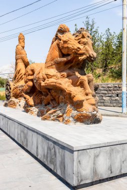 Yerevan, Armenia - July 10, 2024: Statue of Argishti I the king of Urartu on two horses near Erebuni Fortress museum in Yerevan city on sunny summer day clipart