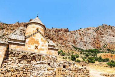 bottom view of Surb Karapet (St. John the Baptist) church in Noravank monastery in Vayots Dzor Provinces, Armenia on sunny summer day clipart