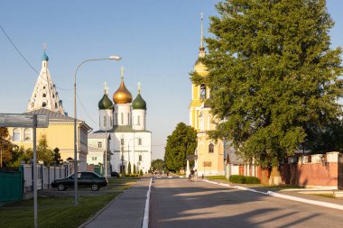 Lazareva street and view of churches and cathedral on Sobornaya square in Kolomna Kremlin in Old Kolomna city on summer evening clipart