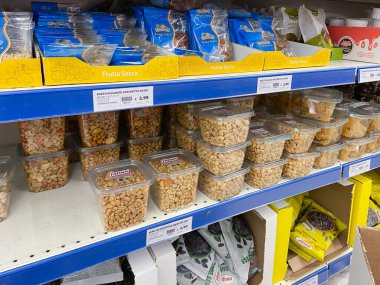 Venice, Italy - February 12, 2023: shelves with packed nuts and dried fruits and prices in Prix supermarket in Venice city clipart