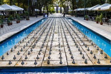 Yerevan, Armenia - October 1, 2023: water fountain in Shahumyan Park on Vazgen Sargsyan St in Kentron district of Yerevan city on autumn day clipart