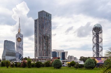 Batumi, Georgia - September 16, 2023: modern skyscrapers and Alphabetic Tower near seaside boulevard in Batumi city on cloudy autumn day