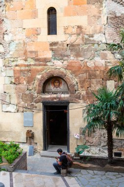 Tbilisi, Georgia - September 25, 2023: entrance to Anchiskhati Basilica of St Mary in Tbilisi city on overcast autumn day. It is is the oldest surviving church in Tbilisi, dates from the sixth century clipart