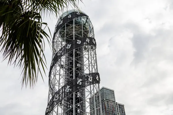 Batumi, Georgia - September 16, 2023: view of Alphabetic Tower and gray cloudy sky in Batumi city . The tower symbolizes the uniqueness of Georgian alphabet and people