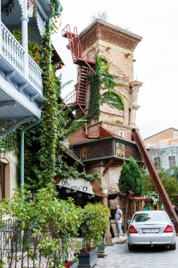 Tbilisi, Georgia - September 25, 2023: edifice of Tbilisi State Puppet Theater named after Rezo Gabriadze on Ioane Shavteli street in old Tbilisi city on overcast autumn day clipart