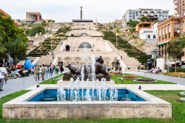 Yerevan, Armenia - September 29, 2023: fountains and sculptures on boulevard of Tamanyan street near Cascade staircases in Yerevan city in autumn clipart