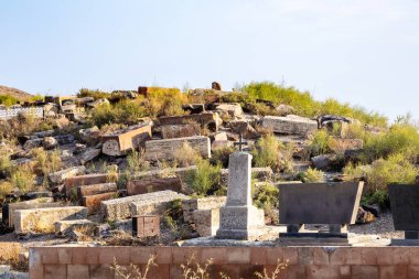 old cemetery on hill near Pokr Vedi village in Ararat plain in Armenia on sunny autumn day clipart